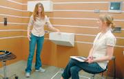 Lauren Daly and Hannah Fiechtner talk about the placement of items in their makeshift hospital room and how Velcro attachments help doctors easily change and move the items. A group of Kansas University design students is working to improve the architectural and overall environment of hospitals.