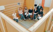 Seated from left, students Hannah Fiechtner, Lauren Daly, Kiki Chandler, Lauren Deck, Natalie Bonebrake and Tin-Ray Chang, and Justin Eakes, standing, compare notes about their project.