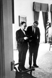 This photo provided by the John F. Kennedy Presidential Library shows Arthur M. Schlesinger Jr., left, and President Kennedy on July 26, 1962, in the White House Oval Office. Schlesinger died Wednesday after suffering a heart attack while dining with family members in New York. He was 89.