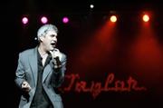 Taylor Hicks performs at the Mobile Civic Center Theater in Mobile, Ala. So far the "American Idol" winner&squot;s first album sales are lagging behind those of past "Idol" winners.