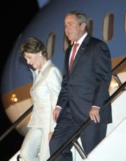 President Bush and first lady Laura Bush arrive Thursday at Guarulhos International Airport in Sao Paulo, Brazil.