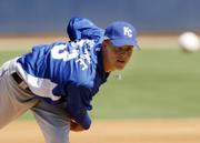 Kansas city's Zack Greinke delivers against Milwaukee. The Brewers defeated the Royals, 7-6, on Friday in Phoenix.