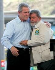 President Bush and Brazilian President Luiz Inacio Lula da Silva embrace Friday after a joint statement at a Petrobras fuel distribution center in Guarulhos.