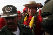 Venezuela's President Hugo Chavez wears a traditional hat during a visit to Trinidad, Bolivia. Chavez's counter-Bush tour reached flood-ravaged Bolivia on Saturday, following up on millions of dollars in aid the leftist leader has pledged to cope with months of deadly flooding in its eastern lowlands.