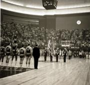 Kansas players, from left, Maurice King, Gene Elstun, Wilt Chamberlain, John Parker and Ron Loneski stand at attention during the national anthem prior to the start of the 1957 national championship game.