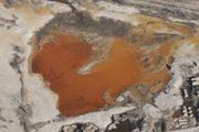 Acid rock drainage colors a body of water reddish-orange near Treece, Ks., rendering the water toxic and lifeless.