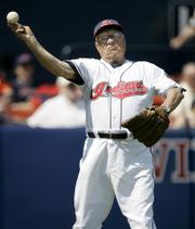 Cleveland Indians hall of fame pitcher Bob Feller throws a baseball prior to a Grapefruit League game Tuesday in Winter Haven, Fla. Feller, 88, attends the Indians' training camp every spring.