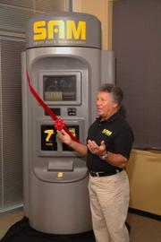 Racing legend Mario Andretti is helping launch Smart Auto Management LLC's new self-service automotive diagnostic kiosk, called SAM. The unit allows drivers to plug a device into a port found in all 1996 and newer vehicles. After running a diagnostic check of the vehicle's computers, SAM prints a list of any needed repairs.