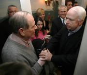 Republican presidential hopeful Sen. John McCain of Arizona shakes hands with Safety Commissioner Richard Flynn during a campaign stop Sunday in Dover, N.H. McCain, 70, has been facing questions about his age.