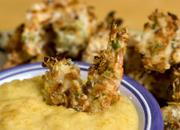 Through baking instead of frying and the use of lower-fat ingredients like egg whites and light coconut milk, shrimp gains a crunchy texture without excessive fat and calories.