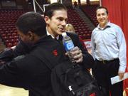 NEW ILLINOIS STATE BASKETBALL COACH TIM JANKOVICH, CENTER, receives a hug from player Keith "Boo" Richardson while John Marczak, ISU director of basketball operations, looks on. Jankovich was named the Redbirds&squot; new coach Tuesday in Normal, Ill.
