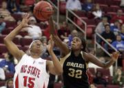 BAYLOR'S BERNICE MOSBY (32) tries to prevent North Carolina State's Ashley Key from getting a loose ball. Mosby's Bears fell to the Wolfpack, 78-72 in overtime, Tuesday night in an NCAA Tournament game in Raleigh, N.C.