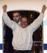 Daniele Mastrogiacomo, a reporter for Italian daily newspaper La Repubblica, arrives at Ciampino military airport Tuesday. Mastrogiacomo was kidnapped in Afghanistan by the Taliban two weeks ago and was released Monday.