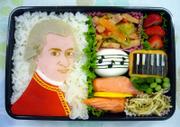 Junko Terashima shows an edible likeness of Mozart in a box lunch she prepared for her child. The intricate presentations are a public way for Japanese mothers - who often forego careers to cater to their families - to demonstrate their devotion to motherhood, dedication to their children's nutrition and creative skills.