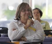 Barbara Lehmann, president of the Dodge Flower neighborhood association in Tucson, Ariz., listens to a presenter in a crime prevention workshop. Lehmann's group is active in fighting methamphetamine use in the neighborhood.