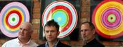 Eric Nicoli, CEO of EMI Group PLC, left, Damon Albarn, center, of the pop group Blur, and Apple Inc. CEO Steve Jobs appear together in the lobby of the EMI record company headquarters in London. Jobs was at the launch Monday of digital rights management (DRM)-free recordings that EMI will make available on the Apple iTunes Web site starting in May.