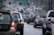 Traffic moves down Wiliston Road in Burlington, Vt. The U.S. Supreme Court on Monday ordered the federal government to take a fresh look at regulating carbon dioxide emissions from cars, a rebuke to Bush administration policy on global warming. In a 5-4 decision, the court said the Clean Air Act gives the Environmental Protection Agency the authority to regulate the emissions of carbon dioxide and other greenhouse gases from cars.