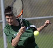 Charlie Moffet, Free State High's No. 1 singles player, returns a volley during his match with Topeka Seaman's Steven Fletcher. Moffet lost the match, 8-3, Tuesday at FSHS.