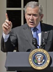 President Bush speaks at a news conference Tuesday in the Rose Garden of the White House. President Bush denounced Democrats for going on spring break without approving money for the Iraq war with no strings.
