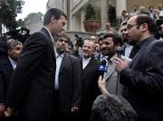 Nathan Summers, left, one of 15 British navy personnel seized by Iran, talks with Iranian President Mahmoud Ahmadinejad, center right, in Tehran. Ahmadinejad announced Wednesday that his government would release the detained sailors and marines as an Easter season gift to the British people.