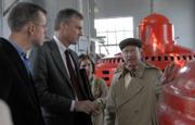 from left, state Rep. Paul Davis, D-Lawrence, and Lt. Gov. Mark Parkinson listen to Stephen Hill, president of Bowersock Mills and Power Co., at right, describe how the hydroelectric plant's generators produce electricity from the Kansas River. In the background is Sarah Hill-Nelson, Hill's daughter and Bowersock's secretary/treasurer. The company is examining the prospects for building a new power plant on the north side of the river.