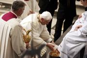 Pope Benedict XVI washes the foot of an unidentified layman Thursday in St. John Lateran Basilica in Rome. The pontiff bathed the feet of 12 laymen, a tradition symbolizing humility, during a busy week of several public appearances.