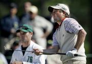TIM CLARK CHECKS OUT HIS CHIP SHOT by the 18th green during the second round of the Masters. Clark finished Friday's round at 2-under 142, good for a share of the lead at the halfway point of this year's event at Augusta National Golf Club in Augusta, Ga.
