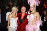 In this photo released by Playboy, from left, Holly Madison, Hugh Hefner and Anna Nicole Smith pose during the 2004 Halloween party at the Playboy Mansion in Los Angeles. Hefner's Playboy will offer three upcoming Smith tributes: a 10-page pictorial in the magazine's May issue, an hourlong retrospective on the Playboy Channel and a memorial on Playboy.com.