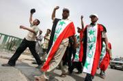 Supporters of radical anti-U.S. cleric Muqtada al-Sadr arrive Sunday in the holy city of Kufa, Iraq, 100 miles south of Baghdad. Al-Sadr called on his supporters to come to the holy cities of Kufa and Najaf to mark the fourth anniversary of the fall of Baghdad today.