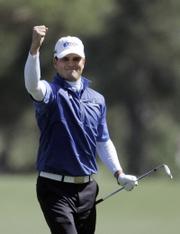 Zach Johnson reacts after chipping in for birdie on the eighth hole. Johnson shot a 3-under 69 in Sunday's final round of the Masters in Augusta, Ga.