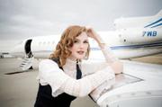 Look fabulous when you travel, and you'll feel rested and self-confident when you reach your destination. Shown above: vintage blouse and vest and jeans by Barney's New York.