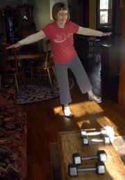 Sue Kapfer, who has multiple sclerosis, does some exercises Thursday. She has been working with a personal trainer for more than a year to increase her strength and coordination.
