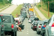 The Wakarusa Music & Camping Festival kicked off with a massive traffic jam in June 2006. Security checks at the festival entry point were blamed for the traffic jam June 8 that had Clinton Parkway and Kansas Highway 10 backed up for several hours.
