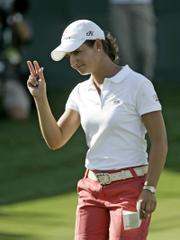 LORENA OCHOA WAVES TO THE GALLERY after finishing her second round at the Ginn Open. Ochoa shot a 6-under 66 on Friday at Reunion, Fla., good for a share of the lead.