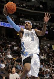 DENVER GUARD ALLEN IVERSON puts up a shot in a game earlier this season. Iverson has been thriving in his new environment after a trade from Philadelphia, and the Nuggets finally have started following suit as the NBA playoffs draw near.