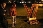 Messages to the victims of Monday&squot;s Virginia Tech shooting are written on a cardboard "VT" that was placed on Drill Field by senior Brandon Stiltner, who had the sign hanging on his wall before the shooting Monday in Blacksburg, Va. A gunman killed 32 people at Virginia Tech and then himself in the deadliest shooting rampage in modern U.S. history.