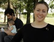 Katie Laird discusses how much information can be found through an Internet search as her husband, Adam Sandoval, plays with their baby daughter, Ella Sandoval Laird, in April in Houston. These days, many people are turning to Internet search engines and other sites to "google" dates. Laird met her husband online.