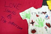 These two T-shirts from the Clothes-line project represent two victims of abuse. The Clothesline Project will also be on display Saturday at the Earth Day celebration in South Park.