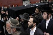 The casket of Liviu Librescu is carried through the street in Brooklyn, New York. Librescu, who was a Holocaust survivor and teacher at Virginia Tech, was killed on Monday during the massacre of 32 people by a student gunman.