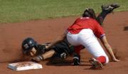 Kansas University shortstop Stevie Crisosto tags out a Missouri runner at second base during the first game of a doubleheader. MU won both games Wednesday at Arrocha Ballpark.