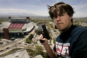 Brent Tenney displays his Glock 9 mm semiautomatic handgun on the University of Utah campus in Salt Lake City, where he is a student. Utah has the nation's only state law that expressly allows the carrying of concealed weapons at public colleges.