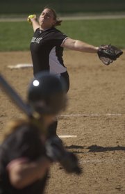 FREE STATE'S CATHERINE SMITH delivers a pitch against Shawnee Mission Northwest. Smith earned a win and a save Saturday in the Firebirds' doubleheader sweep.