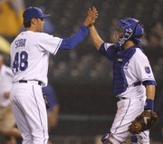 KANSAS CITY PITCHER JOAKIM SORIA, LEFT, and catcher Jason LaRue celebrate after the final out against the Los Angeles Angels. The Royals won, 3-1, Wednesday at Kauffman Stadium.