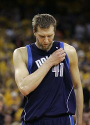 Dallas' Dirk Nowitzki walks up the court late in the Mavericks' season-ending loss to Golden State on Thursday in Oakland, Calif.