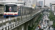 A Skytrain moves along elevated tracks Friday in downtown Bangkok, Thailand. International delegates to a global climate conference on Friday agreed that the world has the technology and money to limit catastrophic global warming, but that it must act now. Using public transportation such as Bangkok's Skytrain and subway system would help cut greenhouse gas emissions.