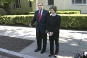 President Bush, accompanied by first lady Laura Bush, declared parts of Kansas a disaster area on Sunday, freeing up federal money to aid in recovery.