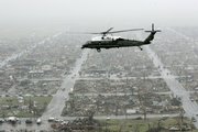 The Marine One helicopter, carrying President Bush, flies over the ruins of Greensburg Wednesday. Bush offered his condolences and federal assistance to tornado survivors.