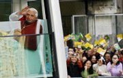 Pope Benedict XVI waves to the crowd from the popemobile in Sao Paulo, Brazil. The pope used an open-air Mass on Friday to stress the importance of sexual morality
