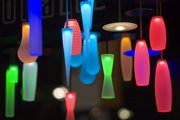 Colored lamps, illuminated by LEDs, are displayed by Winona Lighting at the Lightfair International trade show Tuesday in New York.