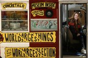 Erika Nelson, of Lucas, drives around the country in her traveling museum titled, "World&squot;s Largest Collection of the World&squot;s Smallest Versions of the World&squot;s Largest Things." Nelson considers her bus as a mobile art piece, which she calls "car art."